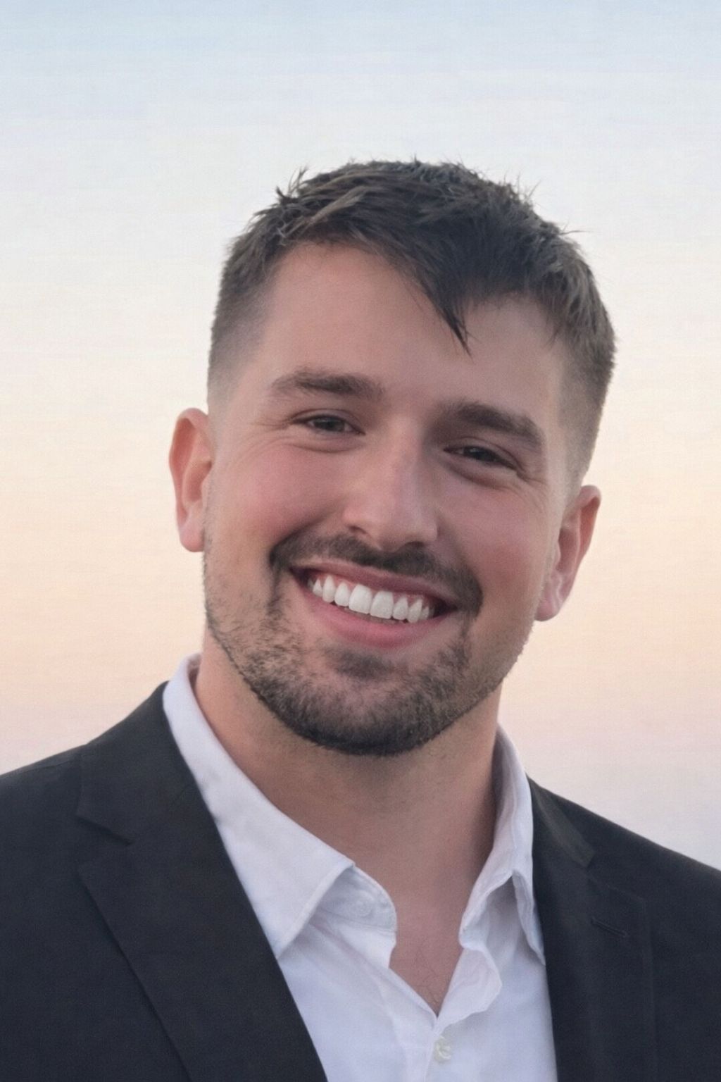 professional executive portrait of a senior male leader in a modern office environment